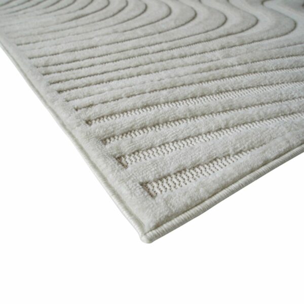 Tapis effet jute et motifs relief vagues blanches